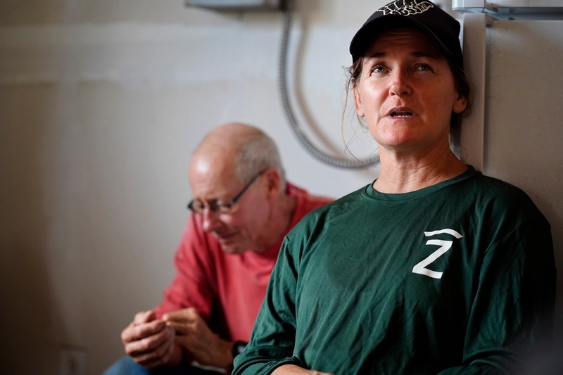 Kainalu Ranch’s Steph Dunbar-Co talks story about Molokaʻi cattle ranchers dealing with the state’s imposed bovine tuberculosis quarantine Wednesday, May 27, 2026, in Kaunakakai. Papohaku Farm’s Jack Spruance listens in. (Kevin Fujii/Civil Beat/2026)