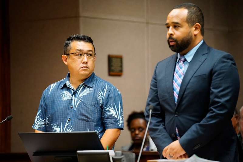 Dexter Kishida, left, and his attorney Addison Bonner listen to Judge Ronald Johnson during his arraignment Monday, June 29, 2026, in Honolulu. Kishida is a former Honolulu government employee accused of defrauding the Hawaiʻi Foodbank during the COVID pandemic. His attorney (Kevin Fujii/Civil Beat/2026)