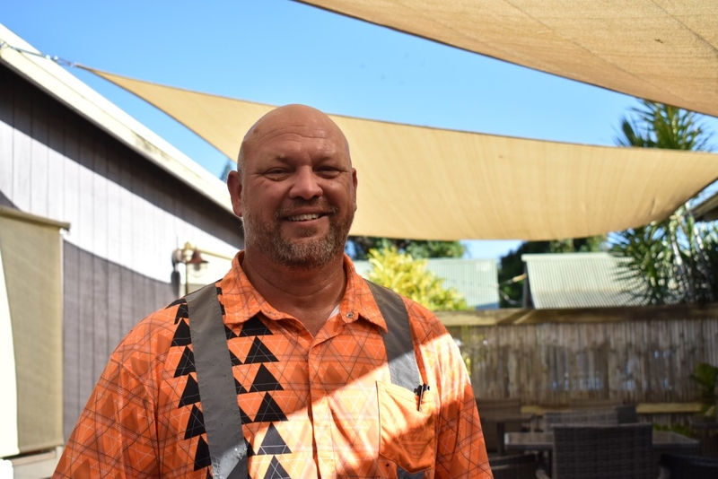 Chad Schimmelfennig stands under the shade in a courtyard in Hanapēpē.