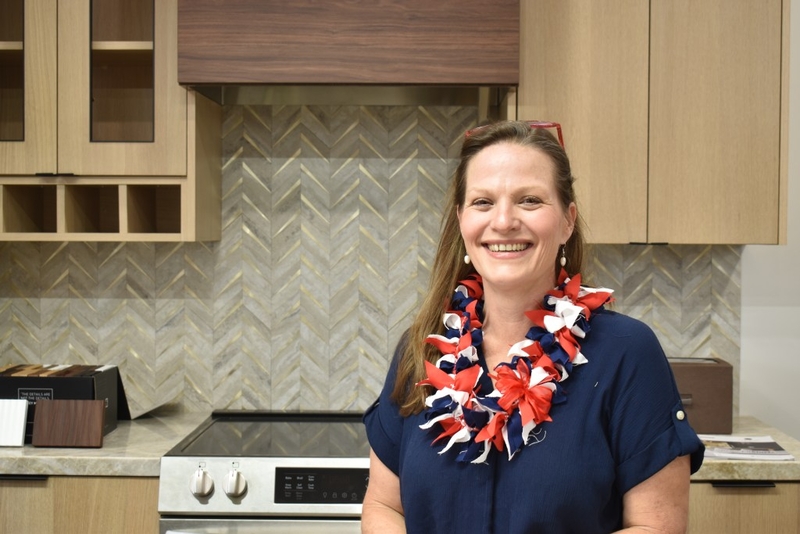Misty Cluett, who is running as a Republican in the Hawai‘i House District 17 race, stands in front of cabinets in her business's showroom in Līhu‘e.