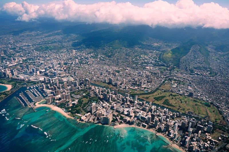 The Ala Wai Canal separates Waikīkī from its surrounding Honolulu neighborhoods photographed from a commuter airplane Thursday, July 30, 2026, over Honolulu. (Kevin Fujii/Civil Beat/2026)