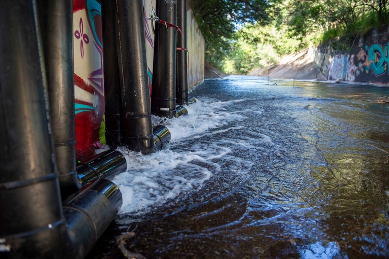 AIEA, Hawaii (Jan. 30, 2022) – Red Hill Well water, filtered through granular activated carbon filters, is discharged at 80% capability into the Halawa Stream. The Interagency Drinking Water System Team is a joint initiative where the U.S. Navy is working closely with the Hawaii Department of Health, U.S. Environmental Protection Agency and the U.S. Army to restore safe drinking water to Joint Base Pearl Harbor-Hickam housing communities through sampling and flushing, and the recovery of the Red Hill Well