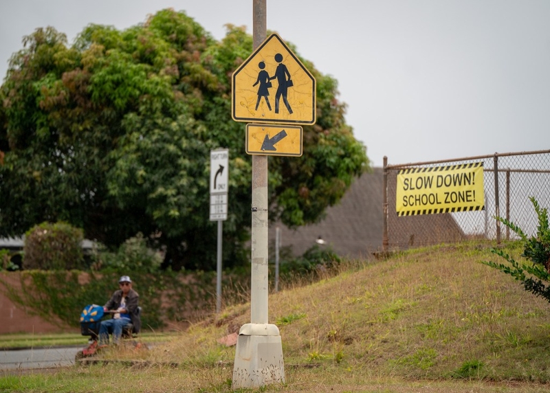 Caution signs at an intersection bordering Mililani Waena Elementary School, July 14, 2026. (Craig Fujii/Civil Beat/2026)