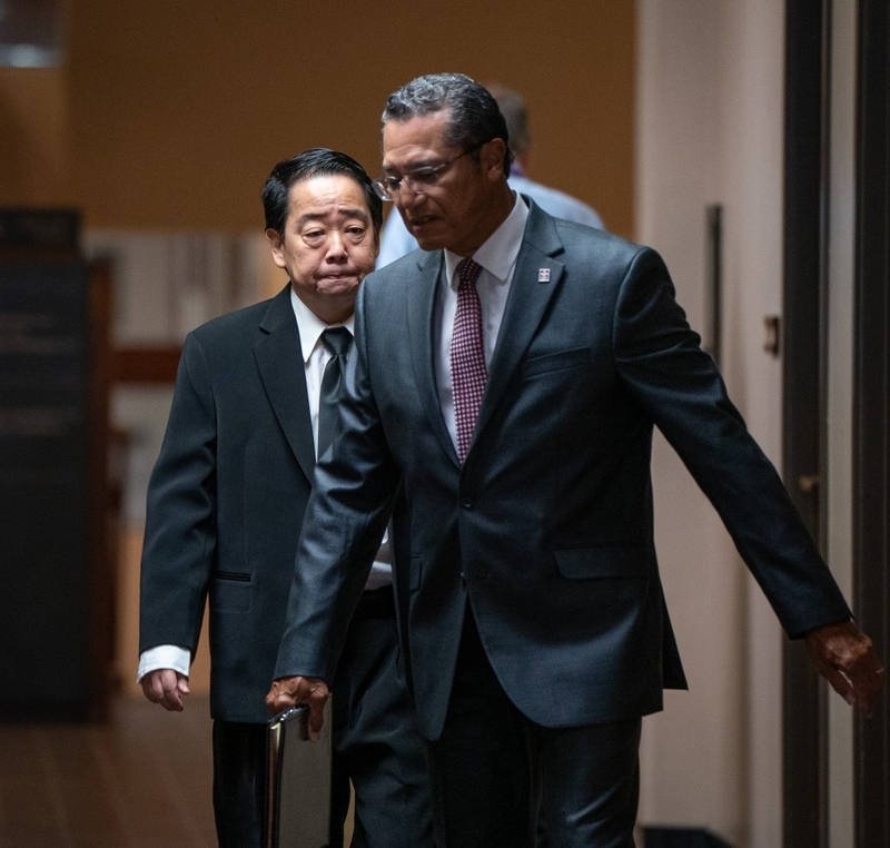 Ryan Yamane arrives for arraignment with his attorney at Kaʻahumanu Hale July 30, 2026. (Craig Fujii/Civil Beat/2026)