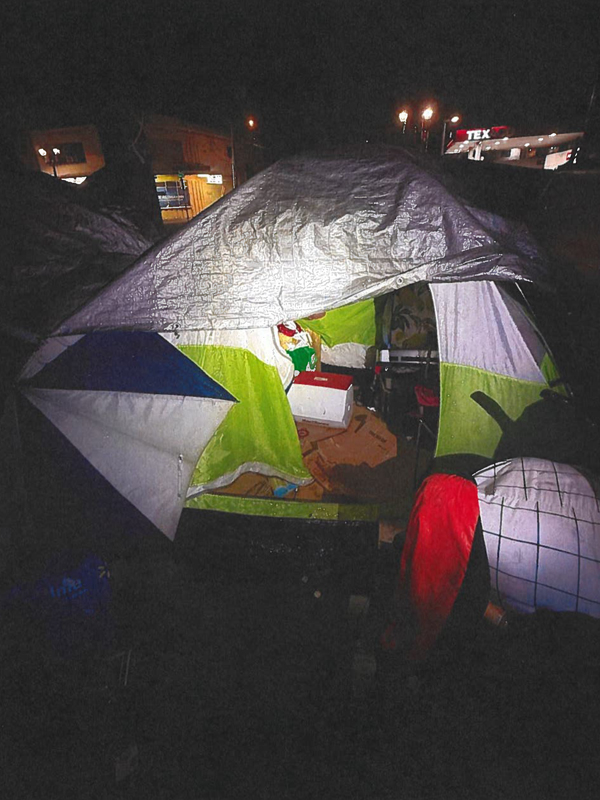 Photo of a tent at night.