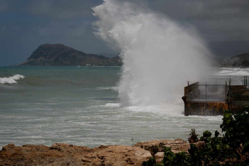 A tower of water sprays into the air after striking a concrete wall at Kahe Point Sept. 8, 2026. Hurricane Lowell brought large choppy surf to Oʻahu's west side overnight. (Craig Fujii/Civil Beat/2026)