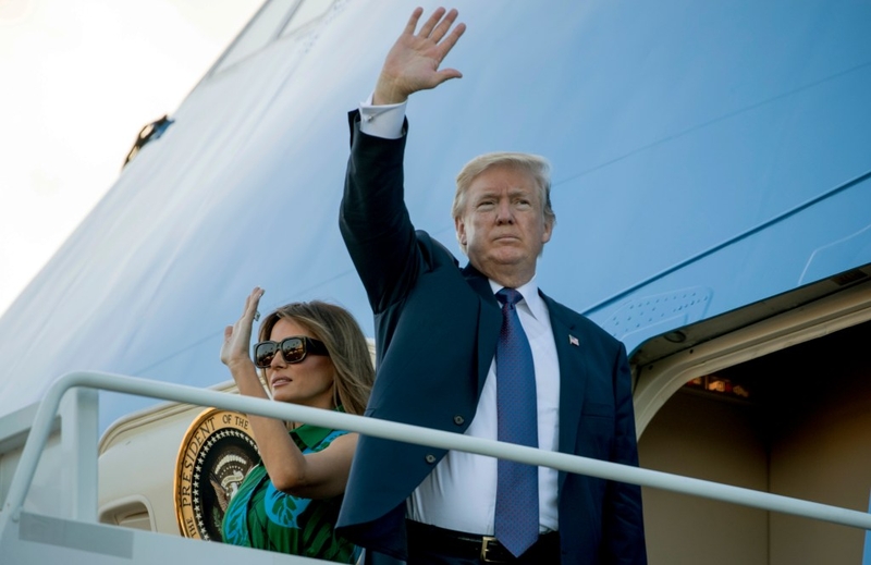 President Donald Trump and first lady Melania Trump board Air Force One at Joint Base Pearl Harbor Hickam, Hawaii, Saturday, Nov. 4, , 2017, to travel to Yokota Air Base in Fussa, Japan. Trump begins a five country trip through Asia traveling to Japan, South Korea, China, Vietnam and the Philippians. (AP Photo/Andrew Harnik)