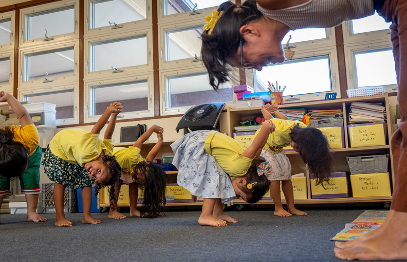 Charity Caracol, right, leads stretching exercises during a class at Love A Keiki Learning Center in Kalihi Sept. 1, 2026. (Craig Fujii/Civil Beat/2026)