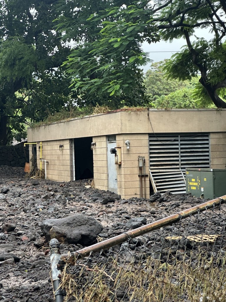 Floodwater from Hurricane Lala on Aug. 15 caused mud and debris to plow into the well power building of  the Punaluʻu Water and Sanitation well power building.