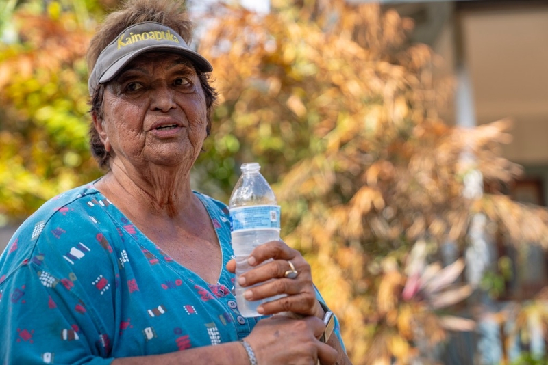Julie Souza discusses the damage after Hurricane Lowell outside her home on Ho‘ona Road in Poʻipū, Sept. 10. (Nathan Eagle/Civil Beat/2026)