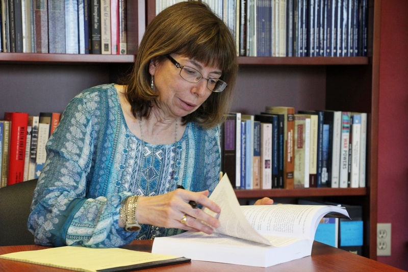 In this Tuesday, July 3, 2018 photo, Margaret Stock, an Alaska-based immigration attorney and a retired Army Reserve lieutenant colonel who helped create the immigrant recruitment program, poses for a photo at her office in Anchorage, Alaska. The U.S. Army has moved in recent weeks to discharge some immigrant recruits and reservists who enlisted through a program that promised them a path to citizenship. Stock said she's been inundated over the past several days by recruits who report being abruptly dischar