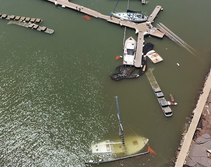 A sunken boat and partially sunken docks at Port Allen in ‘Ele‘ele on Kaua‘i after Hurricane Lowell.