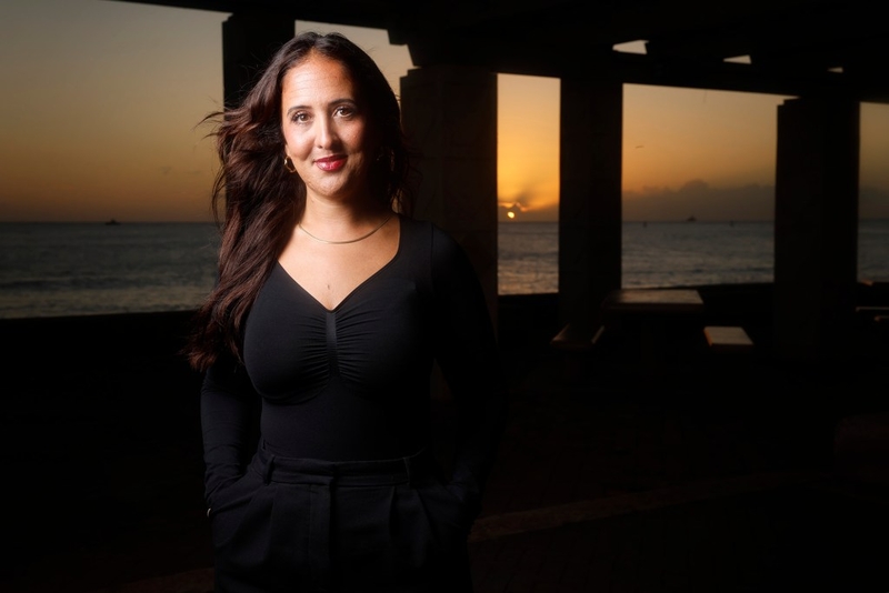Dominique Bird is photographed Wednesday, Oct. 21, 2026, in Honolulu. Bird went public with series of TikTok videos about her former boyfriend who is an alleged scammer. The videos went viral and turned into a multi-state forum for complaints. (Kevin Fujii/Civil Beat/2026)