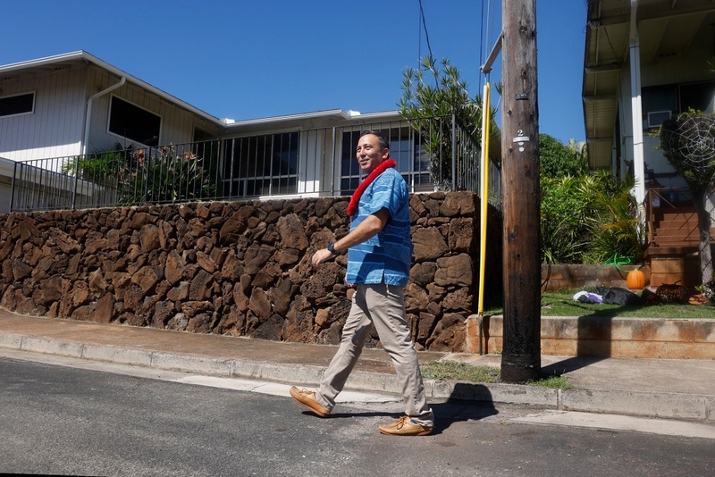 Council candidate Trevor Ozawa walks through the Kāhala neighborhood to campaign Wednesday, Oct. 14, 2026, in Honolulu. (Kevin Fujii/Civil Beat/2026)