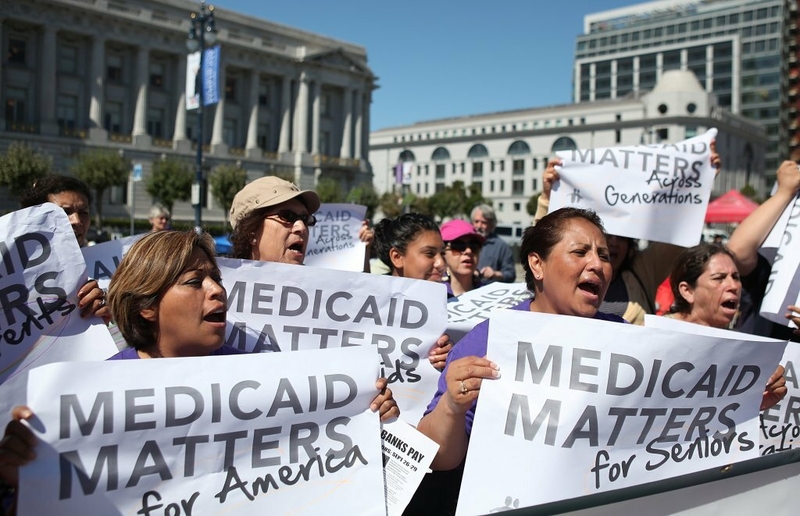 People protest in favor of Medicaid coverage