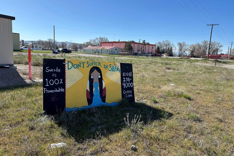 A sign outside the Fort Hall Reservation’s recreation center advertises a suicide crisis number