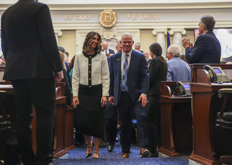 Idaho Senate Majority Leader Lori Den Hartog, R-Meridian, and Idaho House Majority Leader Jason Monks, R-Meridian, walk Gov. Brad Little out of the House chambers after the governor delivered his State of the State Address