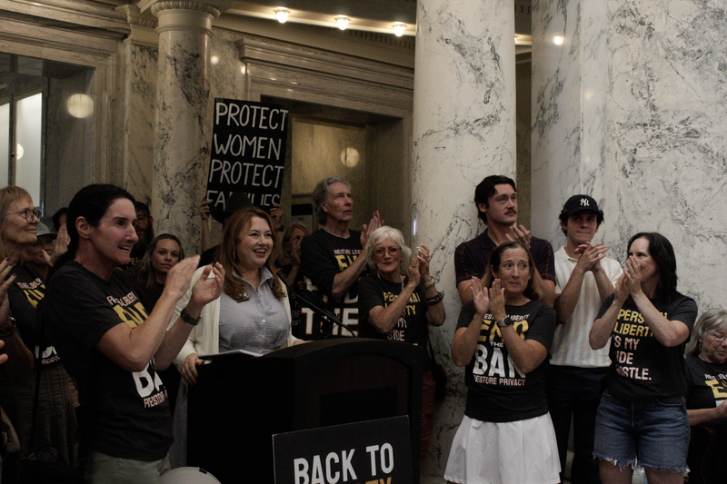 Melanie Folwell, Executive Director of Idahoans United for Women &amp; Families speaks at a podium on July 2 2026.