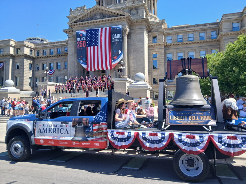 Idaho's replica of the Liberty Bell, moved from its typical home, sits on the back of a Ford F450 flatbed truck.