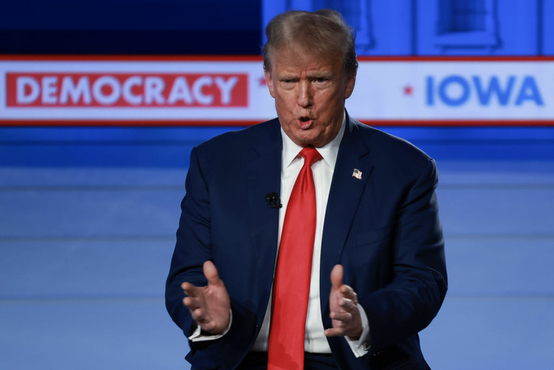 DeSantis and Haley trade accusations at Iowa debate while Trump holds separate town hall