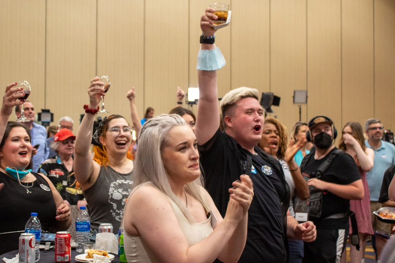 Attendees of the Kansans for Constitutional Freedom watch party celebrate after primary election results verify Kansans voted to keep abortion a constitutional right on Tuesday. (Lily O'Shea Becker/Kansas Reflector)