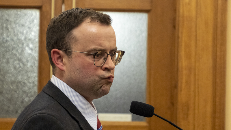 Steve Greene stands at a microphone
