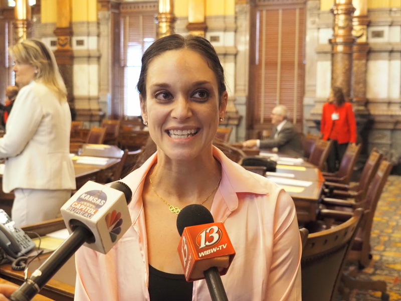 Olympic gymnast Terin Humphrey talks to reporters on the Senate floor
