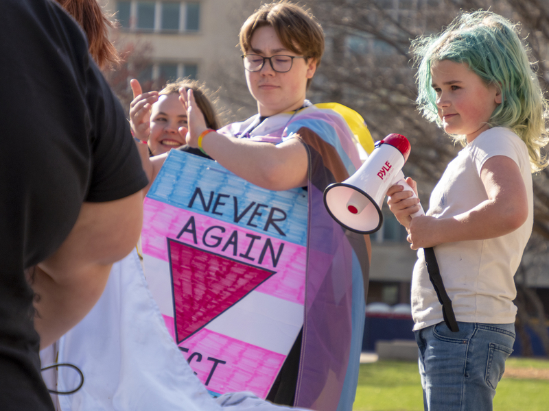Cassandra Robinson delivers a speech Friday at the Statehouse as part of the March for Queer and Trans Youth Autonomy.