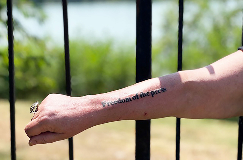 Marion County Record reporter Deb Gruver on Wednesday had the words "FREEDOM OF THE PRESS" tattooed on her arm
