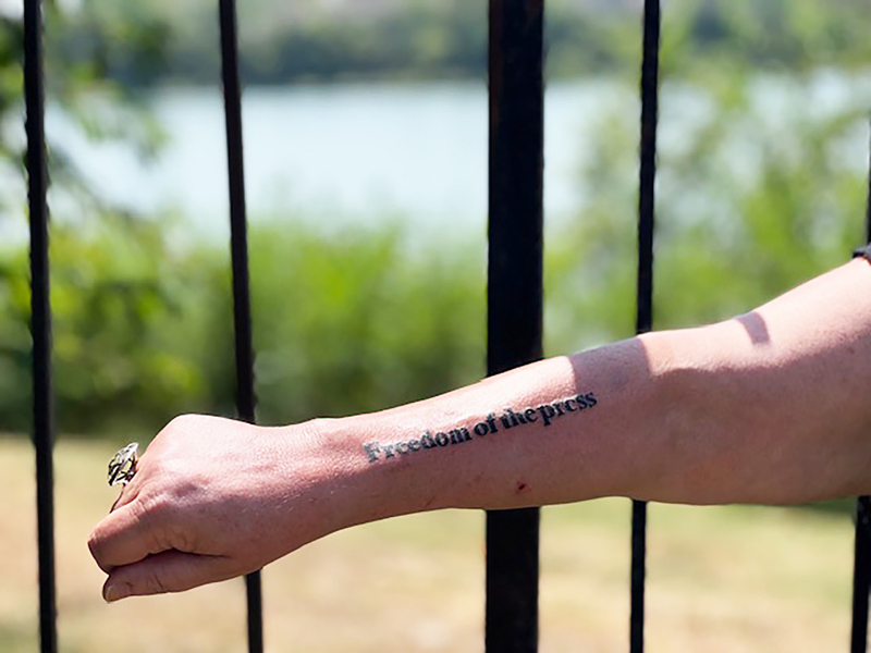 Marion County Record reporter Deb Gruver on Wednesday had the words "FREEDOM OF THE PRESS" tattooed on her arm