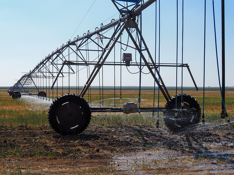 Sprinklers irrigate a field in Hamilton County, Kansas, where some farmers have petitioned to be removed from a local groundwater management district. State lawmakers are pressuring the district to do more to conserve water in the Ogallala Aquifer.