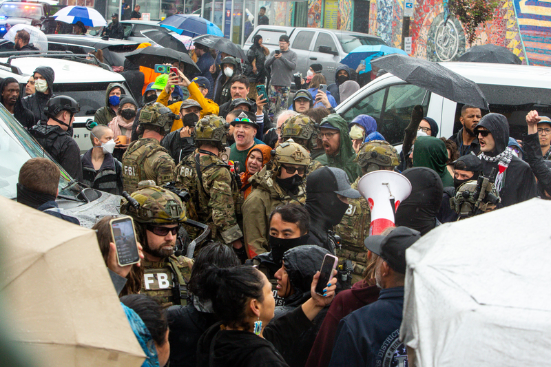 Community members clash with ICE, other federal officers, Minneapolis police, and other state officers on June 3, 2025, as officials raid Las Cuatro Milpas in Minneapolis, Minnesota.