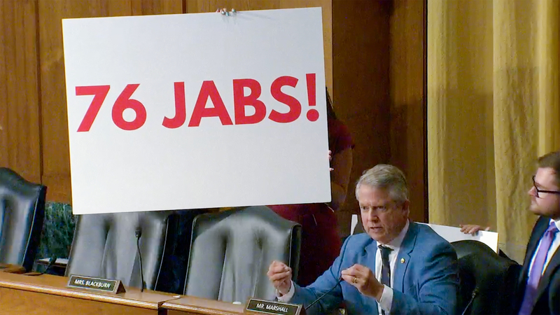 Republican U.S. Sen. Roger Marshall of Kansas describes, with signage, the number of vaccines U.S. children typically receive by the age of 18 during a Sept. 4, 2025, hearing of the U.S. Senate Finance Committee.