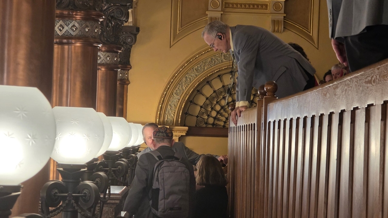 Kansas Senate security personnel remove Rabbi Moti Rieber from a Senate hearing after. he shouted, "Shame on you" when the Senate overturned the veto of a "bathroom bill."
