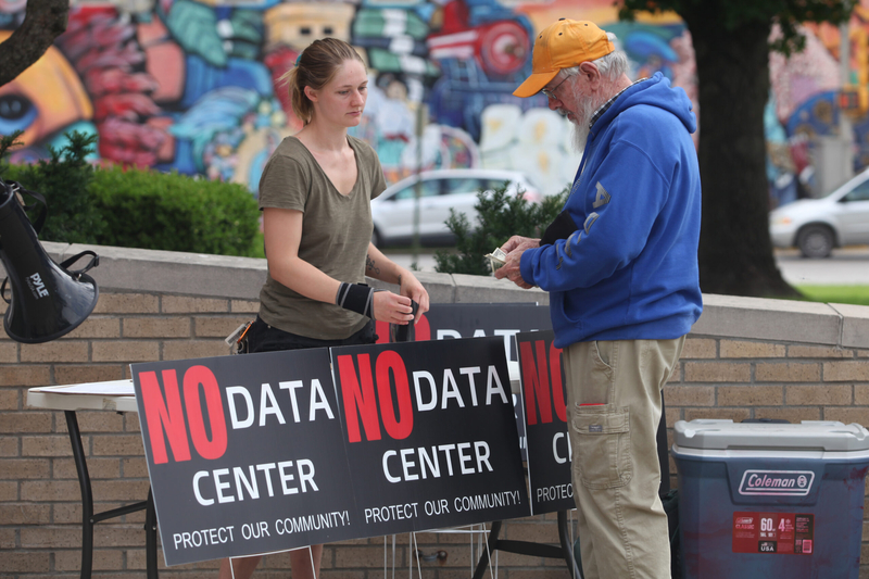 Protesters gather June 23, 2026, in Emporia while public comment is heard about a proposed data center.