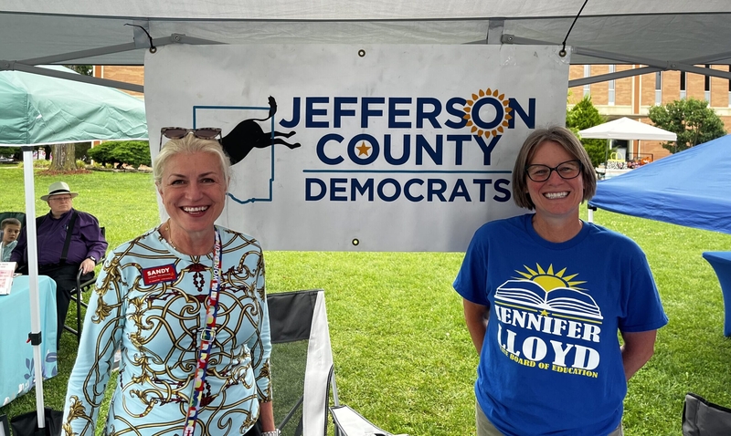 Jennifer Lloyd, right, campaigns at a community event in Oskaloosa