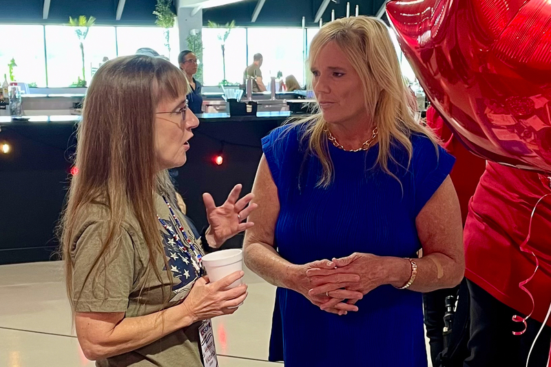 Amy Cawvey, right, campaigns at a Republican convention for a seat on the state education board. (Photo submitted by Amy Cawvey)