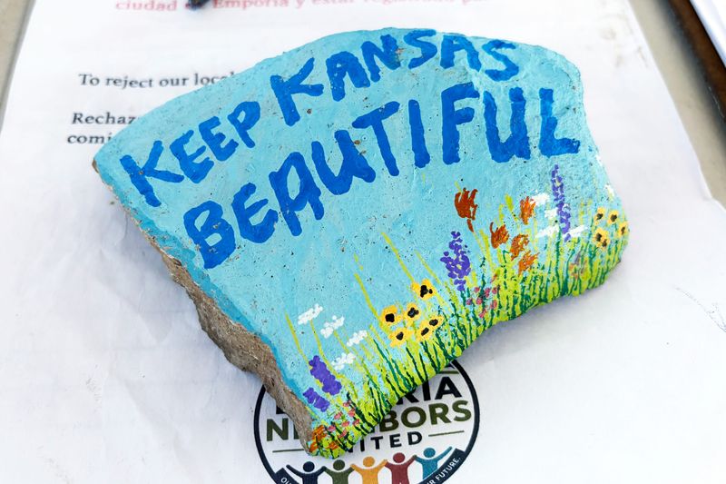 A rock painted by Judith Bilyea was used as a paperweight for a petition seeking to change Emporia's form of government, as seen Aug. 9, 2026.