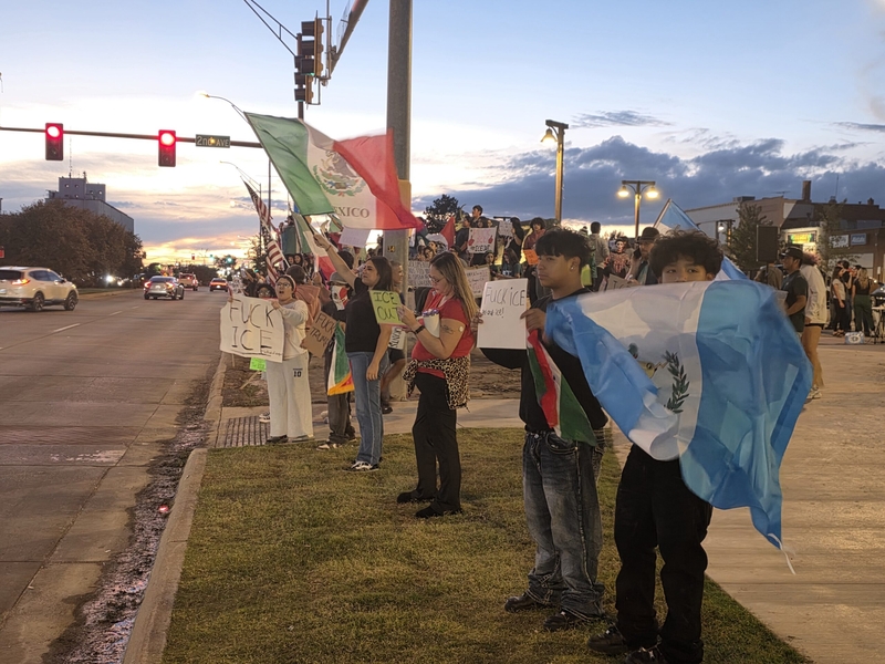 Protesters in downtown Dodge City on Sept. 24, 2026, protest the presence of U.S. Immigrations and Customs Enforcement agents in the community.