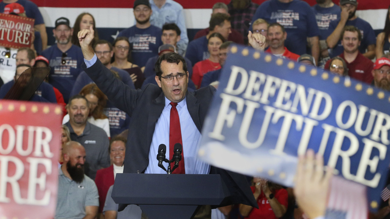 U.S. Rep. Derek Schmidt raises his arms in enthusiasm at the Oct. 26, 2026, rally featuring Vice President JD Vance in Topeka