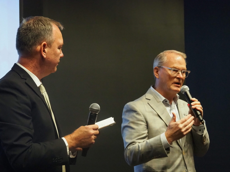 Democratic U.S. Senate candidate Adam Hamilton on Friday denounces reckless use of trade tariffs and  the chaotic political environment in Washington during an appearance hosted by the Greater Topeka Chamber of Commerce. Hamilton is campaigning to unseat U.S. Sen. Roger Marshall, a Republican. (Photo by Tim Carpenter/Kansas Reflector)