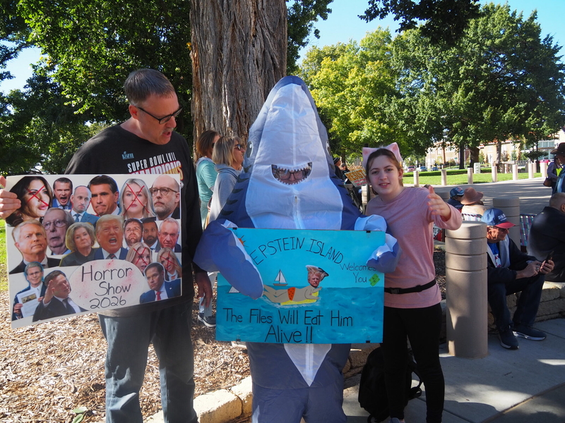 The family of Kevin, Michelle and Harlan Manning offers a colorful take on politics Saturday outside the Kansas Capitol during a rally to spur voter participation in the Nov. 3 midterm election