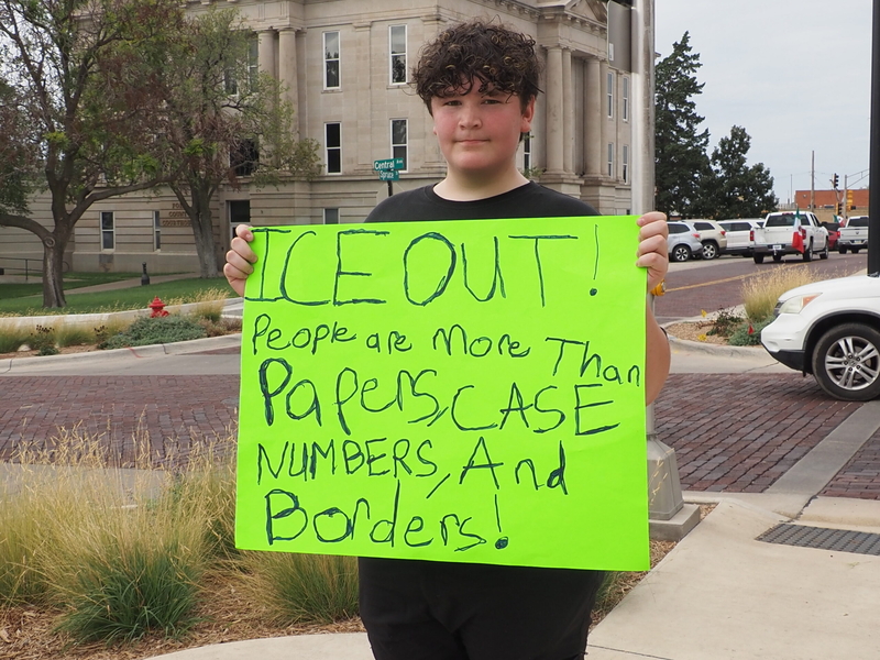 Priest Mercado, 15, attends a Dodge City march on Sept. 25, 2026, to protest the presence of U.S. Immigration and Customs Enforcement agents detaining immigrants in his community. He said that he doesn't believe families should be torn apart. (Photo by Morgan Chilson/Kansas Reflector)
