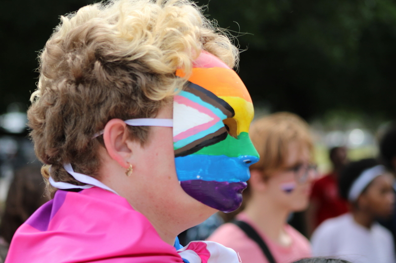 A student at Ben Franklin High School in New Orleans wears a mask with the transgender Pride flag painted on it Friday, March 31, 2023.