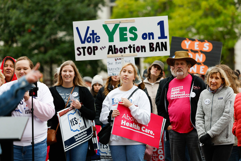 Michelle Black of Columbus listens to Lauren Blauvelt speak during the Ohioans for Reproductive Freedom Bans OFF Columbus rally for Issue 1, Oct. 8, 2023, outside the Statehouse in Columbus, Ohio.