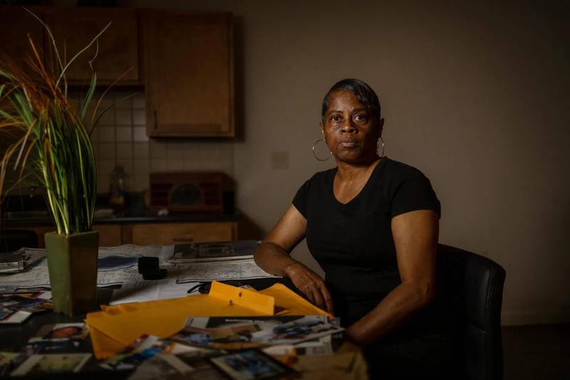 Janice Parker sits at a table at her home in New Orleans.