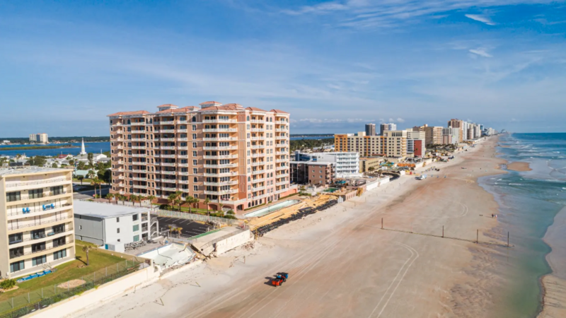Construction crews restore a beach in Daytona Beach Shores, Florida, following erosion from hurricanes Ian and Nicole.