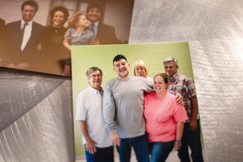 A photo of Jimmie Duncan with his family and friends during a visit at the Louisiana State Penitentiary at Angola placed on top of a photo of his parents, Sharon and Bennie.