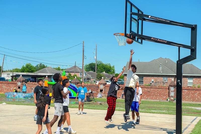 Children play basketball at a recent family event at the Wat Thammarattanaram.