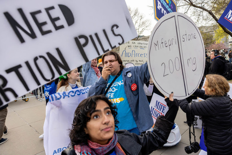Demonstrators gathered in front of the U.S. Supreme Court as justices heard arguments in March 2024 about medication abortion, the most common method in 2023, according to the Guttmacher Institute. (Photo by Anna Rose Layden/Getty Images)